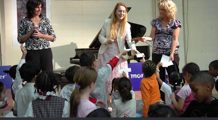 Katya Grineva visiting a classroom of young students during a school program
